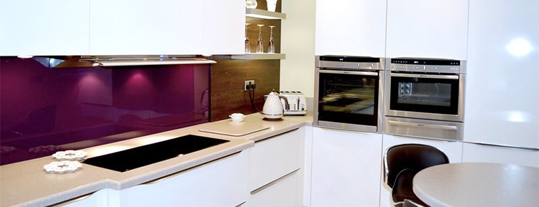 purple coloured splashback used in a modern kitchen